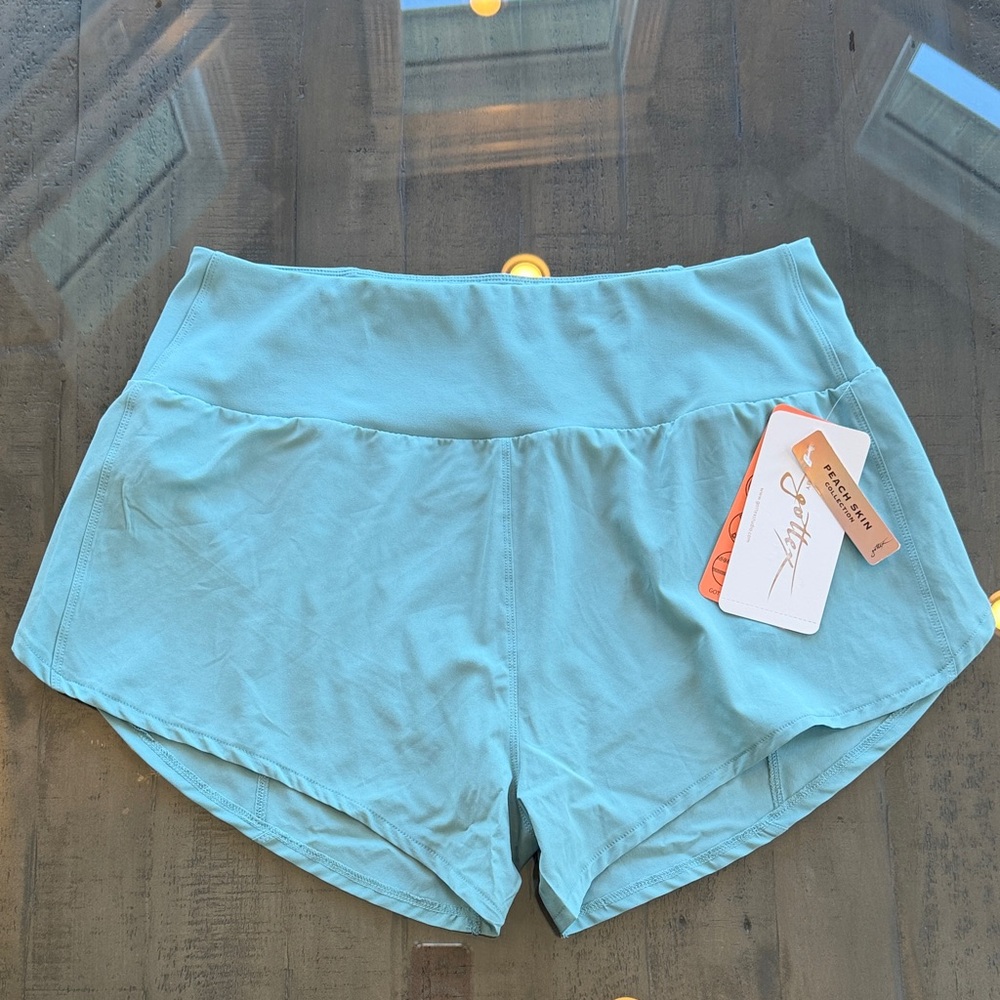 NWT Gottex Dusty Sage Women's Athletic Shorts. Size Large. Has liner. Zip pocket